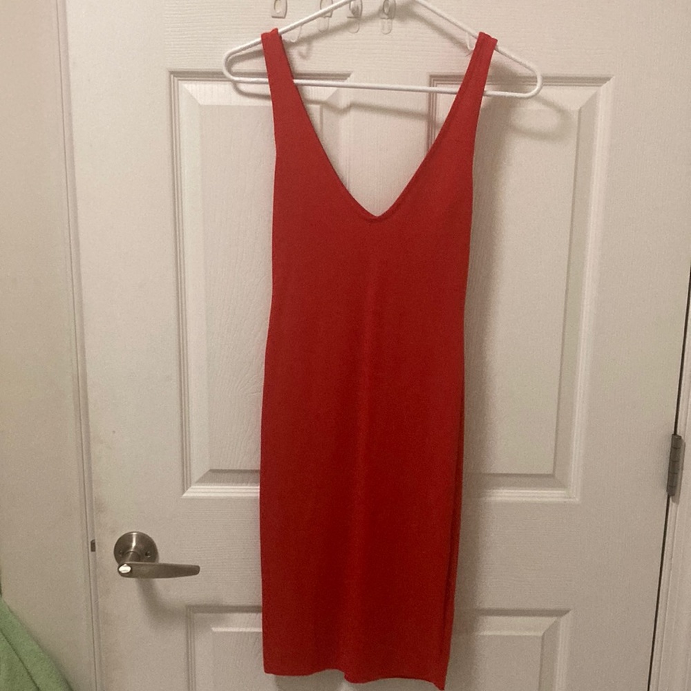 Cute, size small, cherry red dress. Never worn. Mind condition.